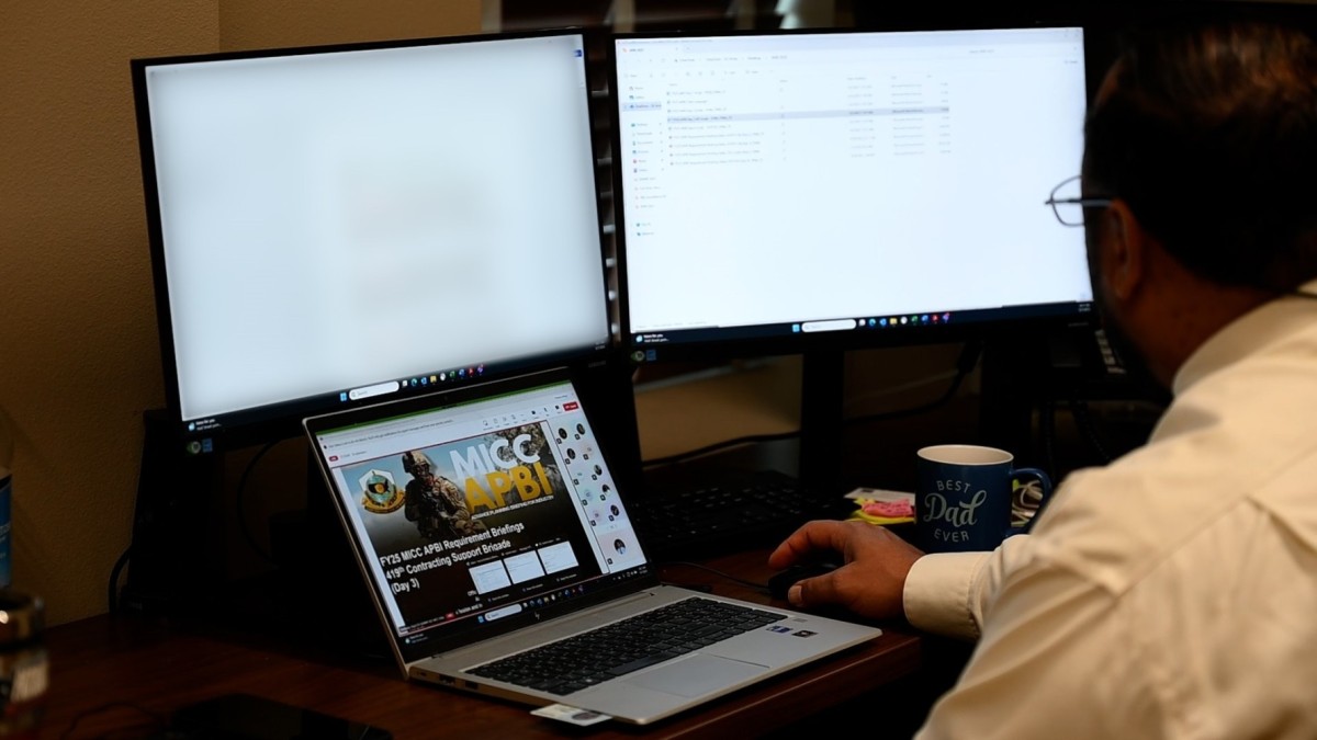 image of individual working on his computer