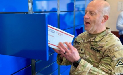 image of service member opening mailbox